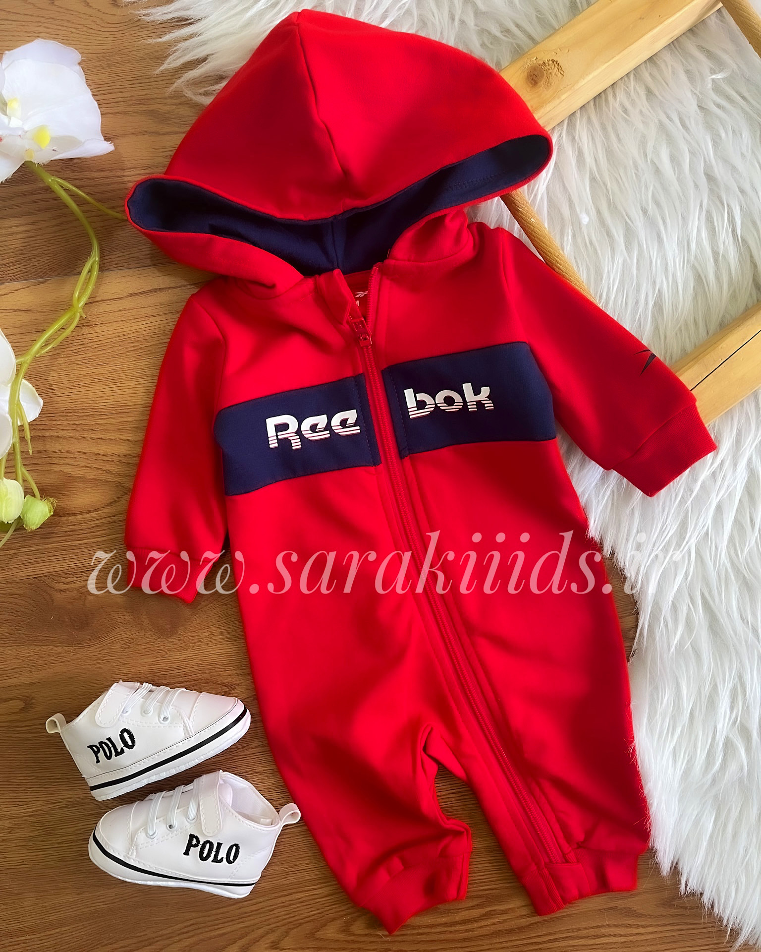 8F4B1D77-60DB-401D-910A-0FEEE4FB9E06 سرهمی نوزادی کلاهدار ریبوک برند وارداتی - تصویر 1